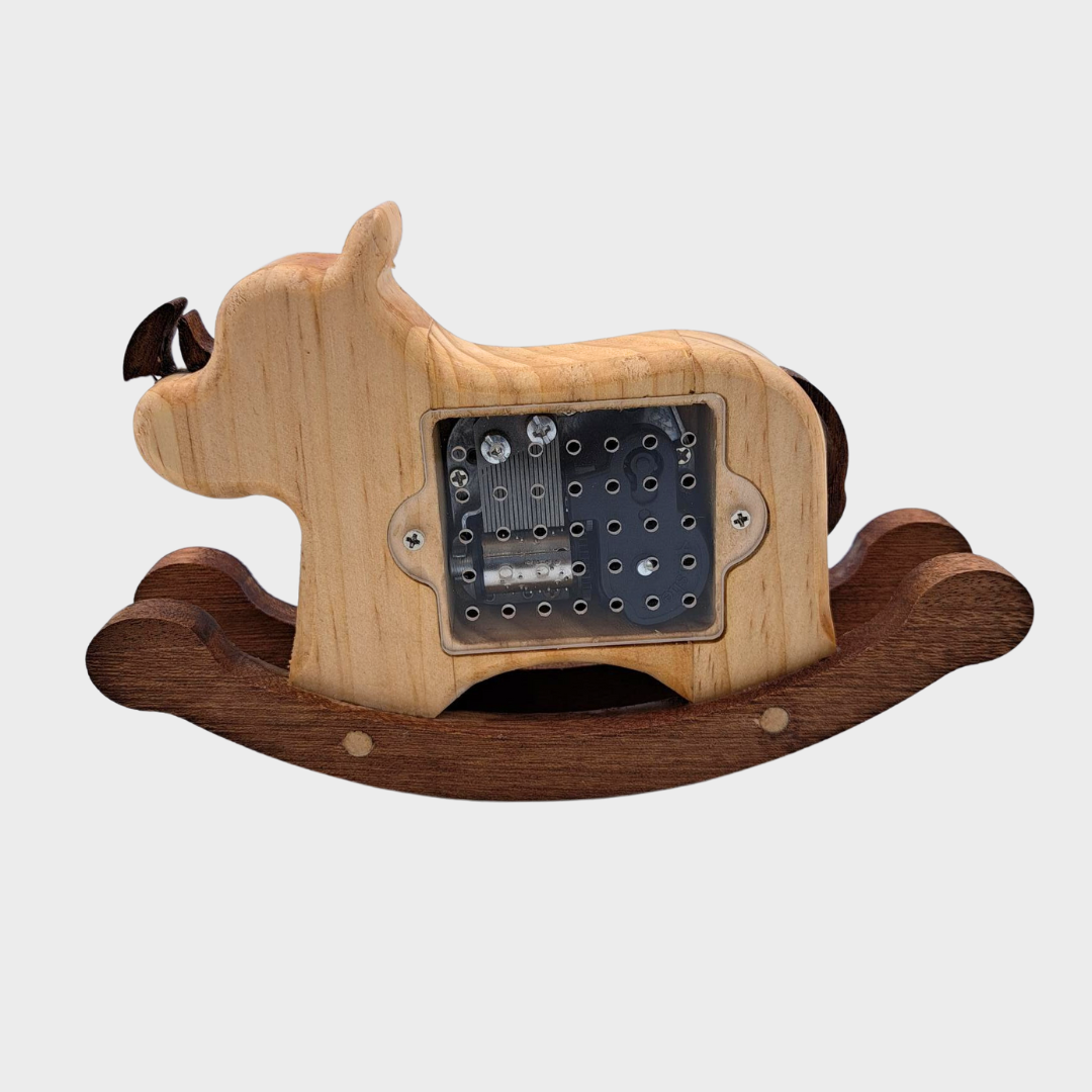 Schommel muziekdoos Ricky Rhino